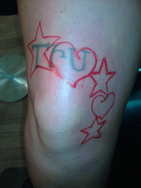 tattoo cover up of a name above knee Custom drawn designed by Tripp Da 