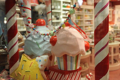 Candy canes and cupcakes in the candy store window, the Night before Christmas, Seattle, Washington, USA by Wonderlane