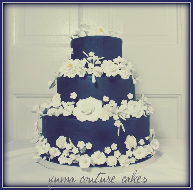 Royal blue airbrushed fondant cake with a gazillion white gumpaste flowers