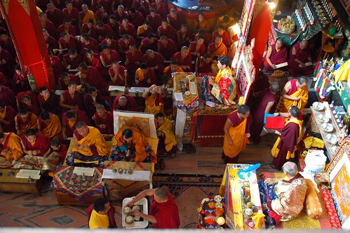 Lamas serving Long Life Rice to His Holiness Jigdal Dagchen Rinpoche, Lamdre dedication mandala offering completed, with his grandson Avikrita Rinpoche leading the assembly of monks, nuns, lay people, Tharlam Monastery, Boudha, Kathmandu, Nepal by Wonderlane