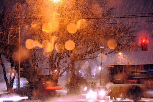 Snowy Aurora Avenue (Route 99) & 130th intersection, action in the snow storm, night, cars and trucks, red arrow, street light, trees, wires, overpass stairway, Albertson sign, driving in dangerous conditions, Seattle, Washington, USA by Wonderlane