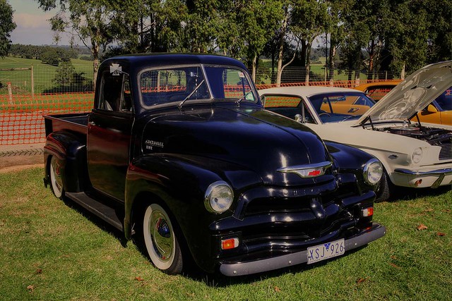 Lowered and painted black this 54 Chevy pickup truck looked great