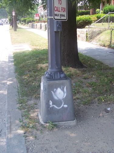 Graffiti flower on the base of a streetlight, North Capitol Street NE