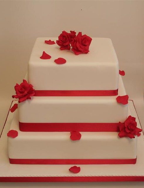 Square ivory wedding cake with hand made sugar red roses Cakes Kent