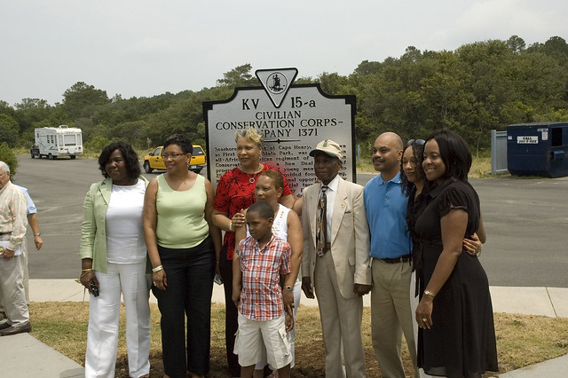 Mr. Claiborne, his children, and grandchildren pose at the historic marker at First Landing.