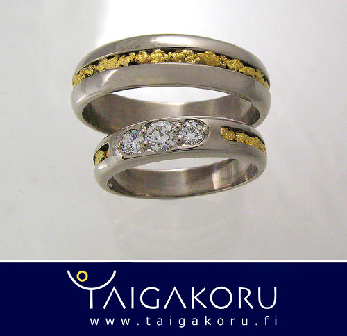 A pair of wedding rings with diamonds Finishing is done with real gold 