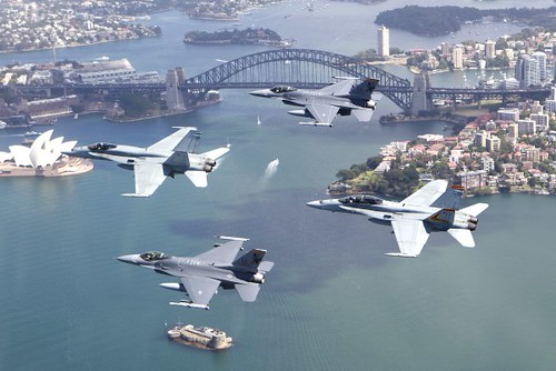 F/A-18 and F-16's fly in formation over Sydney, Australia