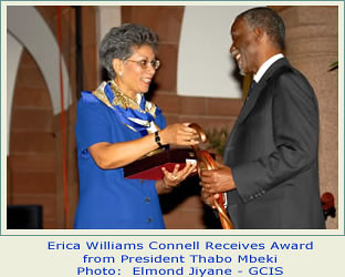 Erica Connell, the daughter of Trinidan-Tobago former Prime Minister, Dr. Eric Williams, receives an award from the former President of the Republic of South Africa, Thabo Mbeki. Connell promotes the research legacy of Williams. by Pan-African News Wire File Photos