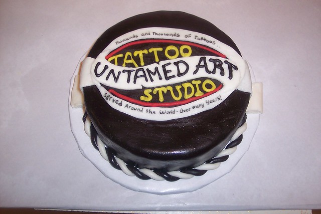 tattoo shop logo cake with fine print