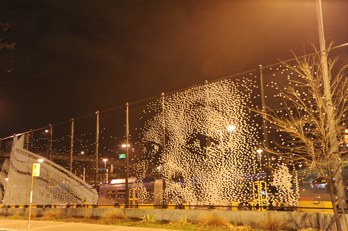 Reading, boy's face, art in fence, Metro Terminal, Seattle, Washington, USA by Wonderlane