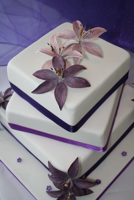 3 tier wedding cake with hibiscus flowers