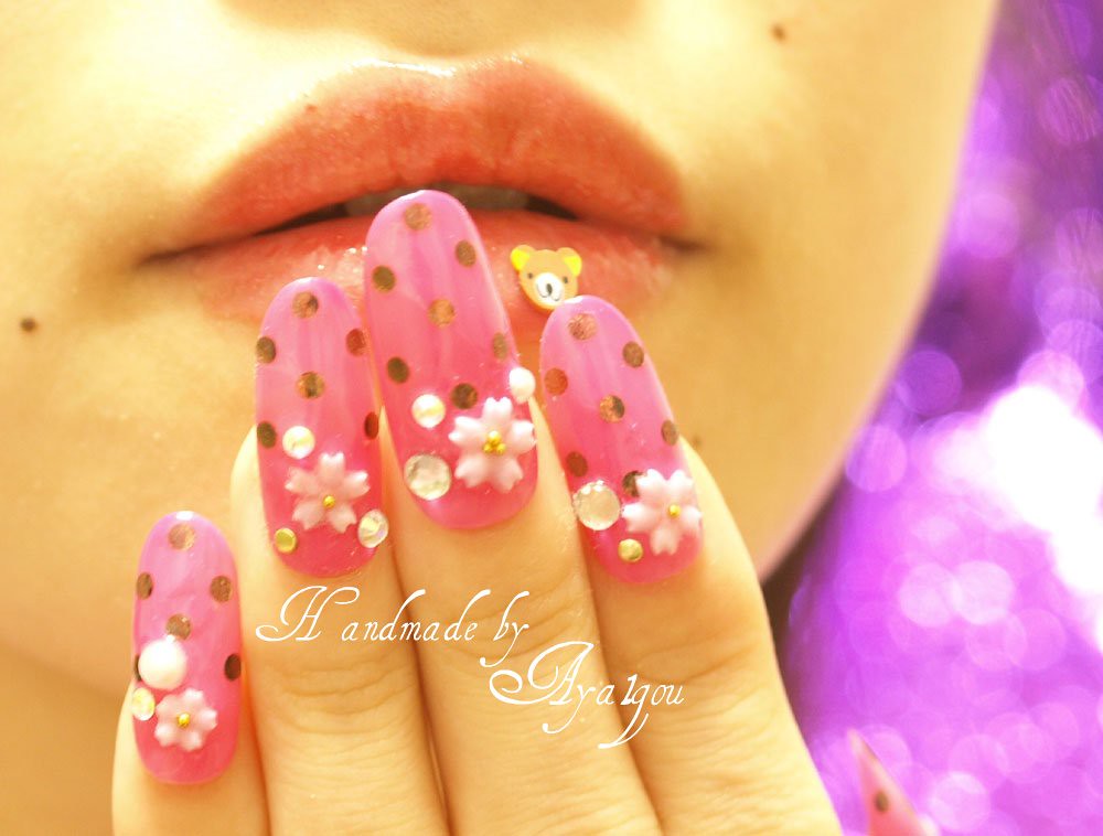 Sakuran, polka dots with 3D flowers and rhinestones nails
