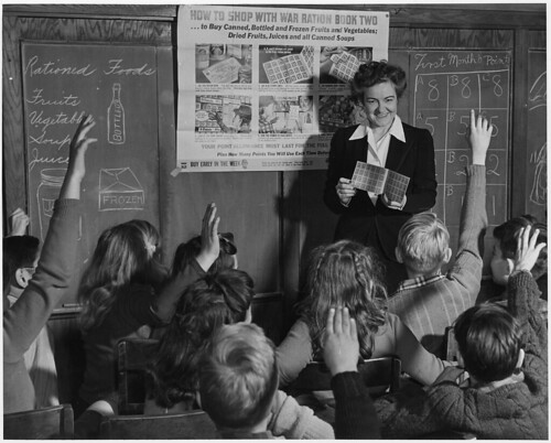 Catherine M. Rooney, 6th grade teacher instructs her alert pupils on the way and how of War Ration Book Two