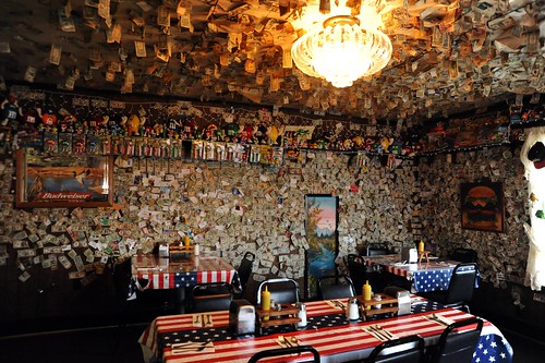The M and M room, American flag tables, dollar bills posted to the wall, table set up, Fat Smitty's, 282624 US Hwy 101, Port Townsend, Washington, USA