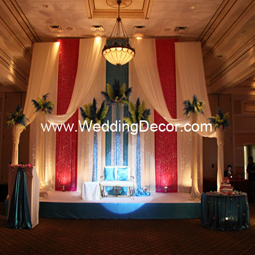  themed wedding reception with a backdrop in turquoise fuchsia and ivory 