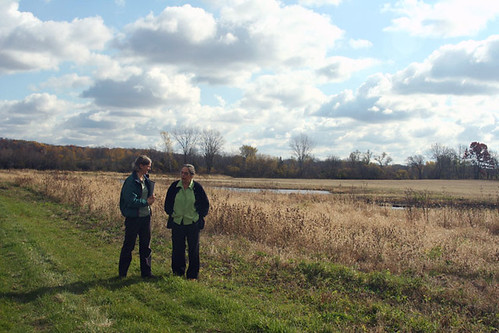 Left to Right, NRCS biologist Kristen Westad visits the wetland restoration area with landowner Elsbeth Fuchs on her Wisconsin farm.