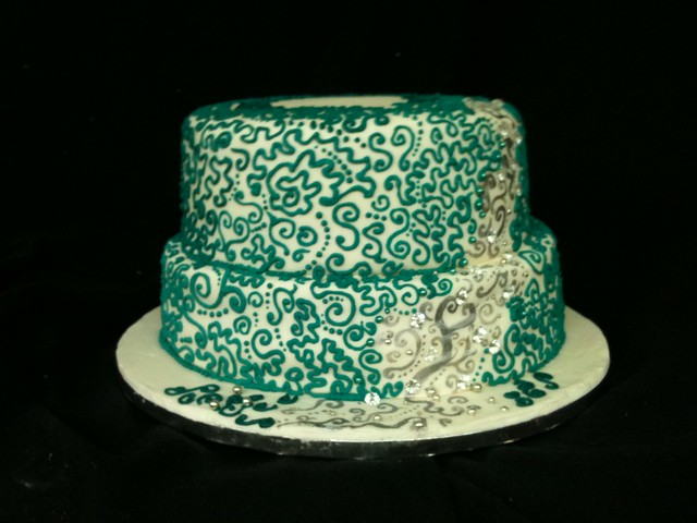 Teal Wedding cake Will have flowers on top Chocolate mudcake with chocolate