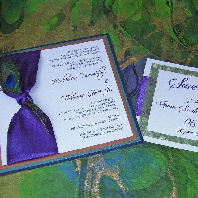 Peacock feather Save the Date and Wedding Invitations that feature satin 