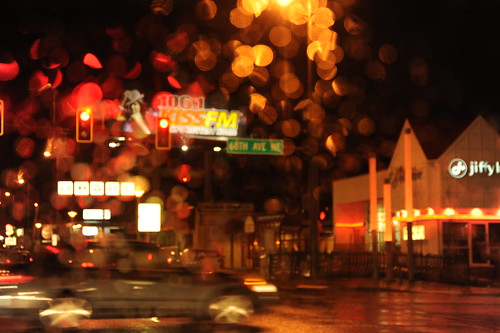 Everything is wet, Aurora Avenue in the rain, traffic lights, signs, car, Jiffy, 66th Ave, KISSFM, Seattle, Washington, USA by Wonderlane