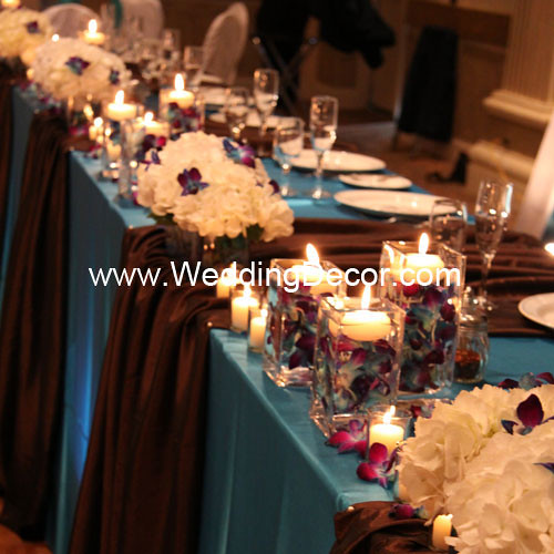 Head table decorations for a wedding reception in turquoise and brown with
