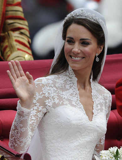 The Duchess of Cambridge waves to wellwishers as she makes her way in the 