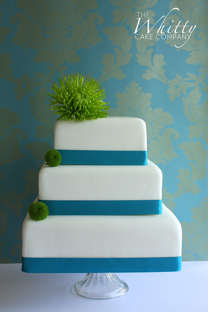 Turquoise Notion wedding cake features one large green chrysanthemum 