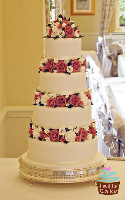 Floral Dusky Rose Wedding Cake Over 200 wired flowers were made to fill the