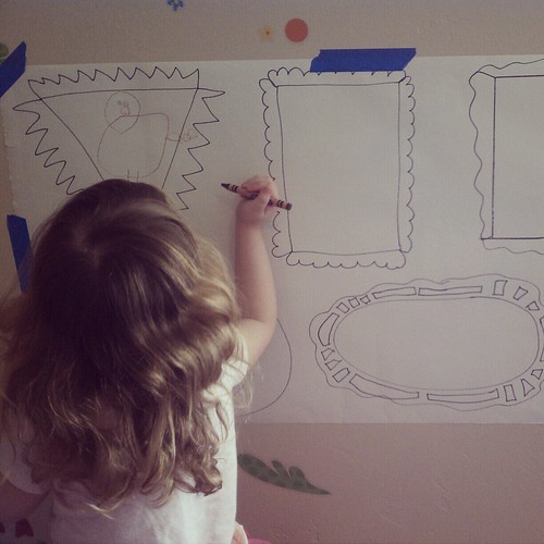 Lily drawing in her frames