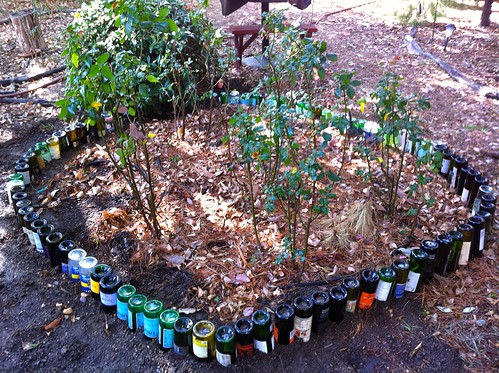 Wine bottle garden bed edging done