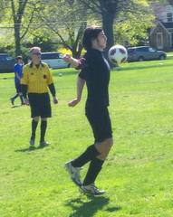 Gabe chesting the soccer ball