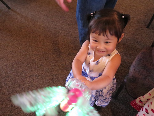 Happy Dani after the service with a light up butterfly.