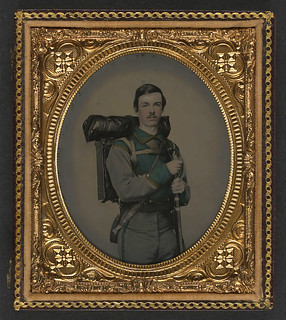 [Unidentified soldier in Confederate uniform of Co. E, "Lynchburg Rifles," 11th Virginia Infantry Volunteers holding 1841 "Mississippi" rifle, Sheffield-type Bowie knife, canteen, box knapsack, blanket roll, and cartridge box] (LOC)