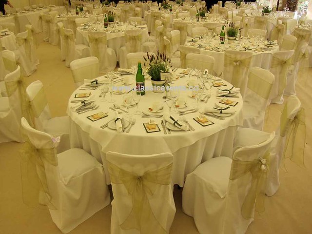 Tailored chair covers on Cheltenham Chairs dressed with pretty sage organza