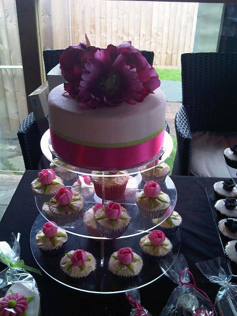 Pink and lime wedding cake Artificial peonies give a striking finish to