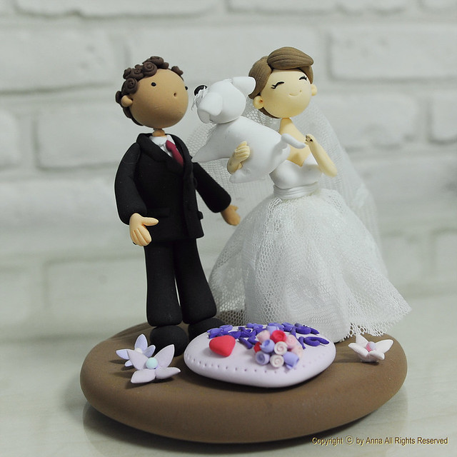 Cute couple with their pet dog wedding cake topper