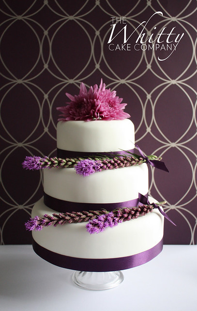  wedding cake purple and pink toned real flowers and purple satin ribbon 
