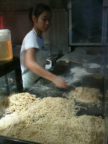 making noodles at the front window