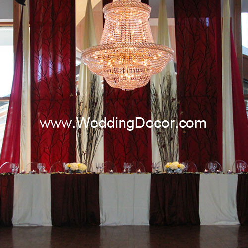  wedding reception with dark red and butter yellow backdrop panels tree 