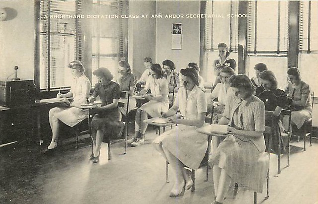 1940s postcard of the Ann Arbor Secretarial School, upstairs in the Nickels Arcade -- "A Shorthand Dictation Class."