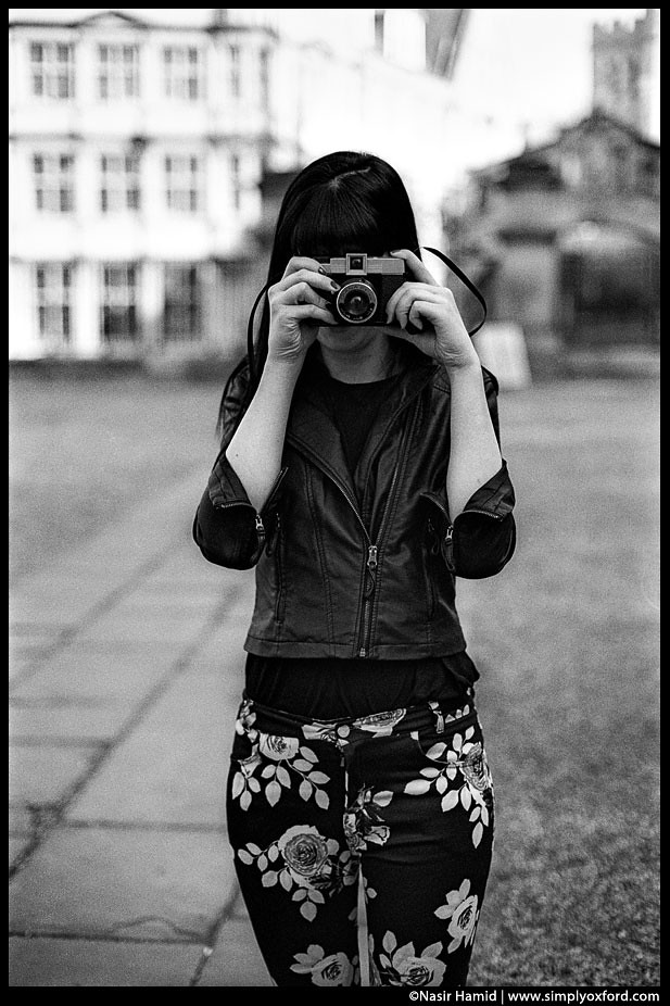 Photographer using a Diana F Lomo camera