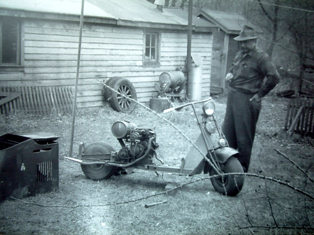 Leon Hoyt Contemplating My Cushman Scooter About 1953 by gswetsky