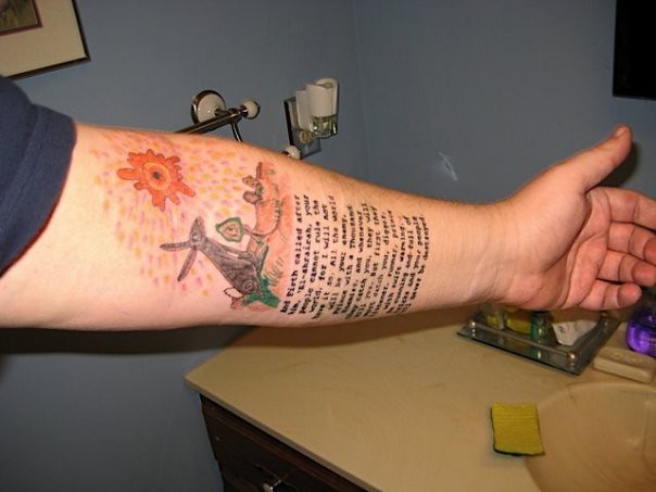 Left arm tattoos Watership Down art above part of the text of the creation 