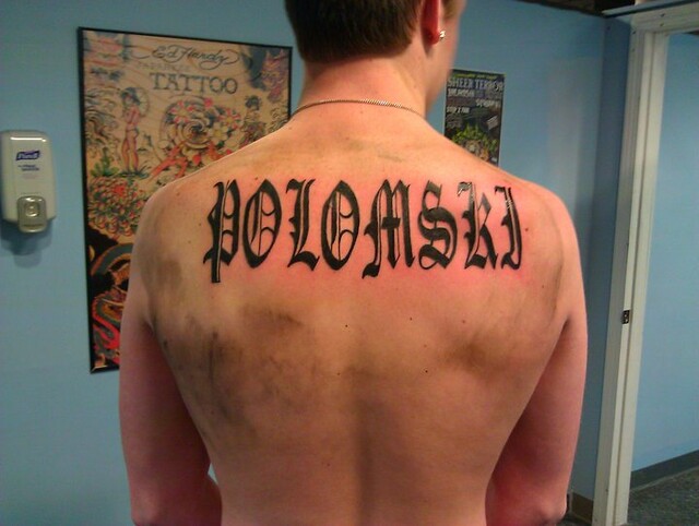 Old english lettering back tattoo by Wes Fortier