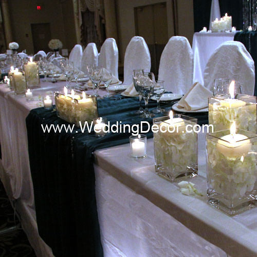 Head table decorations for a wedding reception in hunter green and white 