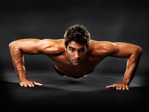 Muscular guy doing pushups