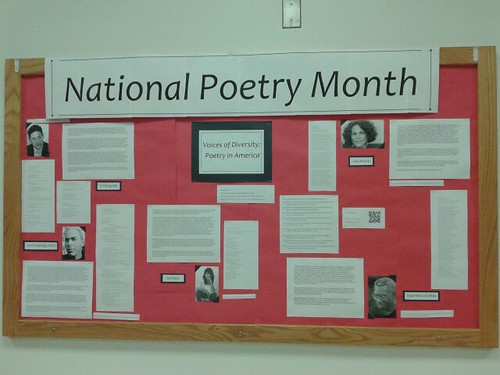 Pictures and readings about poets on a bulletin board