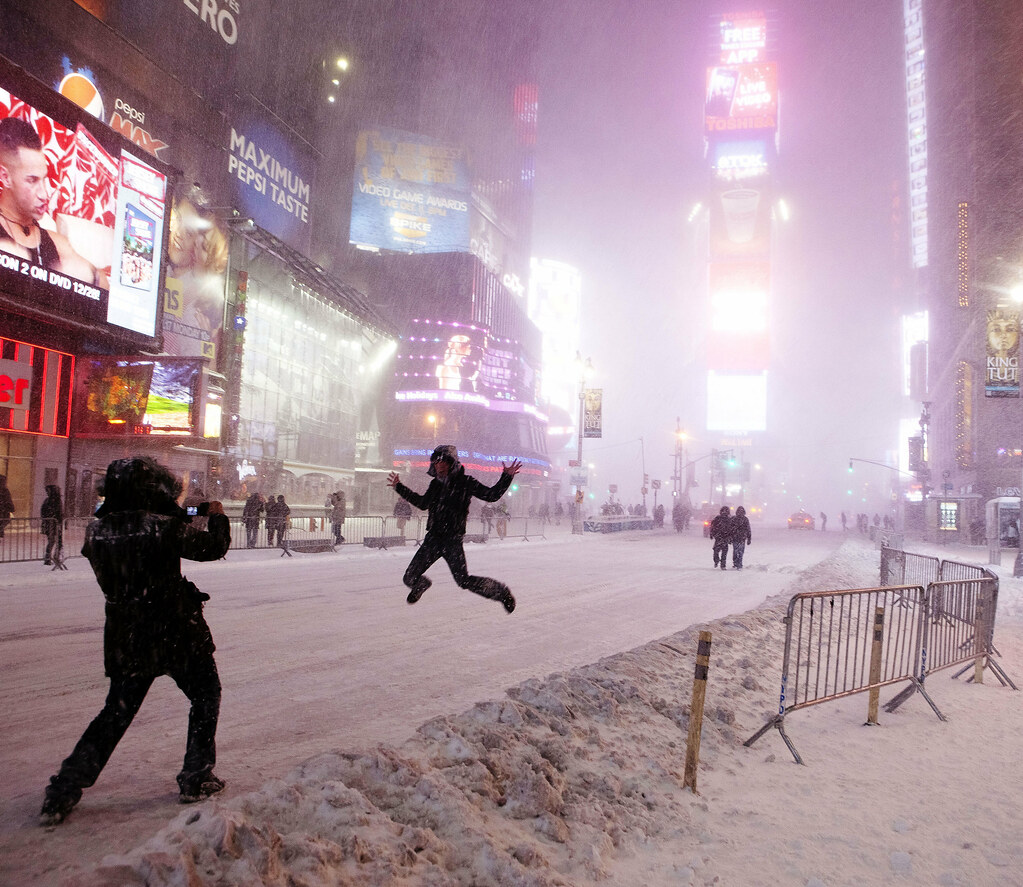 Jumping for joy during New York blizzard, Times Square