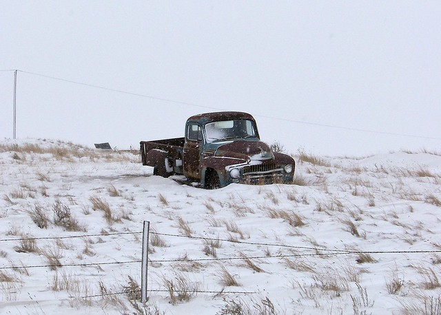 Rusty old pickup truck in winter farm field Rural Municipality of Webb 