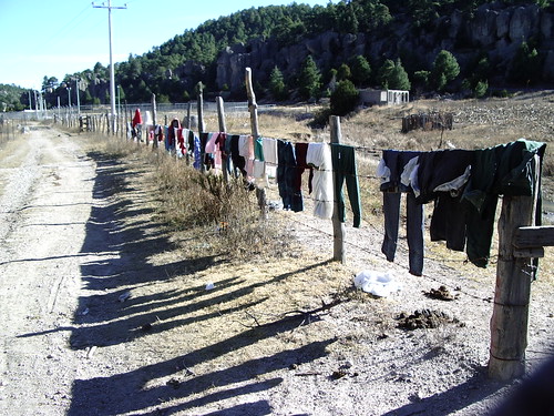 washing drying on barbed wire in Mexico