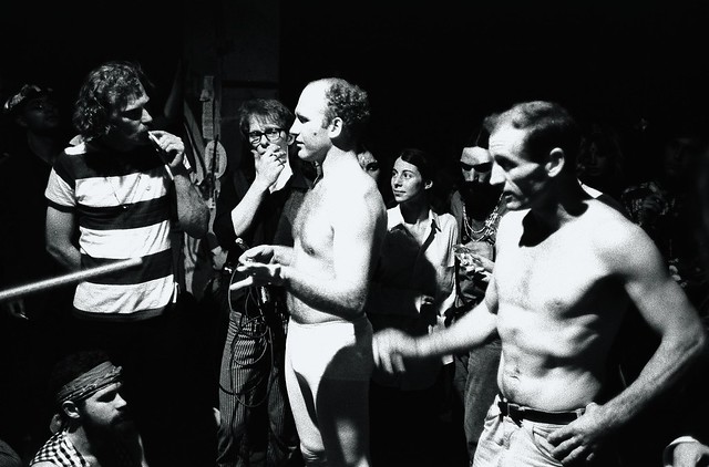 Ken Kesey and Neal Cassady talk to people at the Merry Pranksters' Acid Test